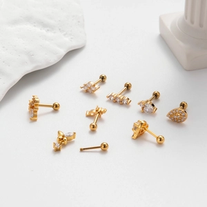 Golden stainless steel cartilage studs set with assorted zirconia heart and butterfly shapes