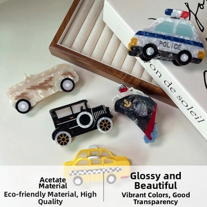 Detailed macro view of acetate hair claws in various creative vehicle and boat shapes