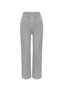 Detail of high-waist grey knitted trousers with vertical ribbed texture and straight cut