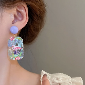 Detail of lavender round studs with rectangular resin floral and flamingo pendant earrings