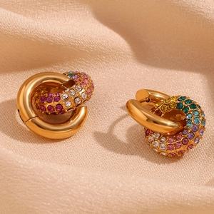 Macro detail of 18k gold plated hoop earrings with rainbow pavé cubic zirconia