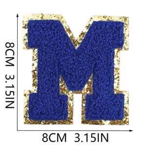 Detailed size view of blue chenille letter M patch with gold sequins border