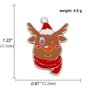 Detail showing dimensions of a reindeer enamel pin with a red hat and scarf