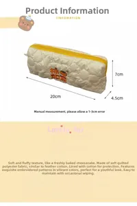 Detailed view of quilted stationery bag with Persimmon embroidery and dimensions 20x7x4.5cm