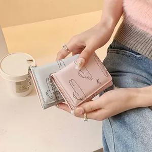 Three-fold leather bow rabbit wallet for women in pink and grey with metal chain