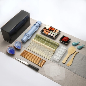 Comprehensive bamboo sushi making kit with rolling mats and diverse kitchen utensils