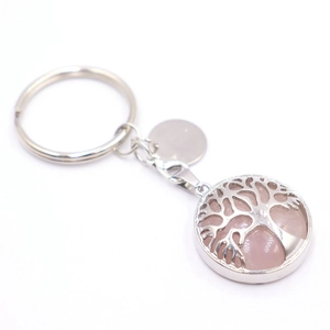 Detail of silver tree of life keychain with pink crystal gemstone and lobster clasp