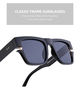 Detail shot of black square sunglasses with classic frame and metal temple hinge