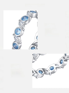 Macro detail of S925 sterling silver ring with blue and white hand-set cubic zirconia