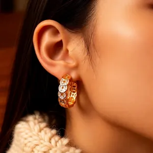 18K gold plated copper coin hoop earrings with white zircon on a model wearing beige knitwear
