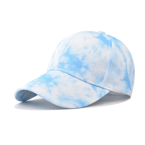 Side view of blue and white tie-dye baseball cap showing cotton twill fabric texture