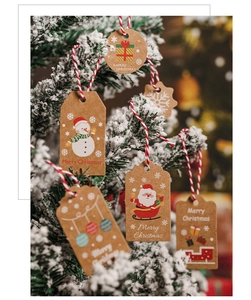 Christmas kraft paper gift tags with strings, festive hanging labels for holiday decor.