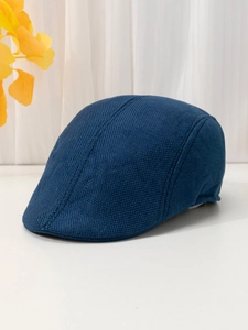 Close-up of navy blue linen flat cap featuring breathable knitted fabric texture