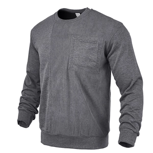 Detail view of men's gray sweatshirt showing corduroy patchwork and front pocket texture