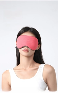 Close-up of dual-sided ice silk sleep mask showing pink mesh texture and breathable fabric