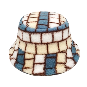 Detail of blue and beige plaid lamb wool bucket hat with soft plush winter texture