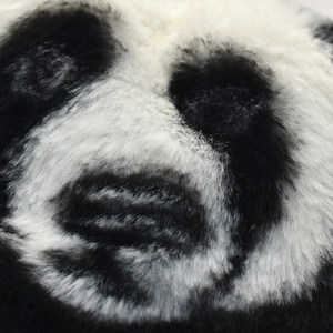 Winter faux fur panda bucket hat featuring black and white plush patterns for men and women