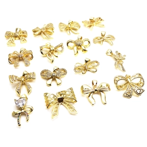 Polished gold bow pendant necklace with cubic zirconia in various minimalist designs