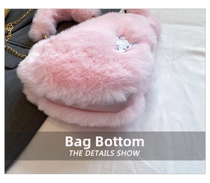 Detail shot of pink fuzzy heart bag with soft faux fur texture and gold chain strap