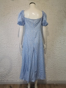 Detail of light blue floral dress back with puff sleeves and invisible zipper closure