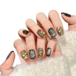 Luxurious black and brown cat-eye press-on nails with 3D metal bows and pearls decor