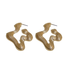 Irregular textured gold geometric hoop earrings with a modern metallic wavy finish