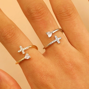 Minimalist double layered open cross ring with heart-cut stone in gold and silver finish