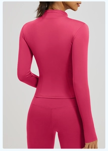 Close-up back view of rose red yoga jacket with standing collar and detailed stitching