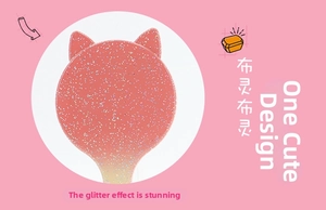 Close-up of glitter finish and cat ear design on pink gradient air cushion hairbrush