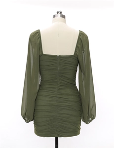 Detail view of the green mesh dress back with invisible zipper and ruched texture