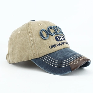 Detail of vintage washed baseball cap with OCEAN letter embroidery and khaki blue stitching