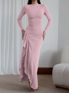 Detail of pink long sleeve bodycon dress featuring elegant side ruching and slit design