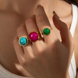 French vintage gold stainless steel rings with colorful gemstones on model's hand