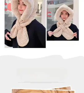 Detail of plush hooded scarf with beige base and white spotted faux fur texture