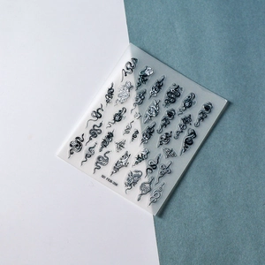 Detailed 5D embossed nail art stickers with black snakes, roses, and butterfly patterns