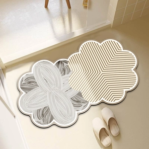 Absorbent wabi-sabi floral bath mats in grey and brown patterns with non-slip backing