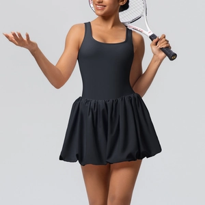 Side view of a black pleated tennis dress with build-in shorts for outdoor sports
