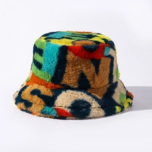 Close-up of colorful faux fur bucket hat featuring bold letter patterns and plush texture