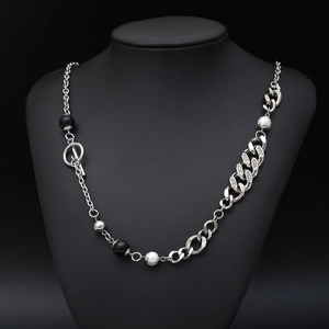 Mixed chain necklace with OT buckle, pearls, black beads and rhinestones on black bust