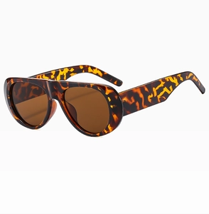 Detail of vintage oversized tortoise shell sunglasses with dark brown protective lenses