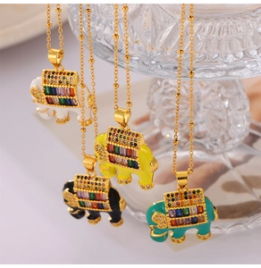 Detail of four colorful enamel elephant pendants with zircons on gold plated chains