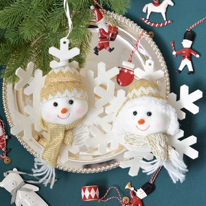 Exquisite snowman plush ornament on silver tray with Christmas tree holiday decorations