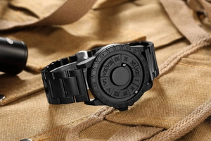 Detail of matte black magnetic ball watch with stainless steel strap on canvas