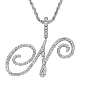 Close-up of pavé-set cursive letter N pendant with silver rope chain and zircons