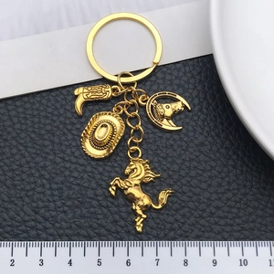 Western cowboy keychain set with gold hat, boots and horse charms on black leather