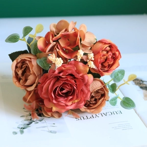 Close-up of vintage silk hydrangea and rose bouquet with autumn tones for home decor