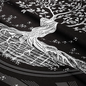 Macro detail of the tree of life fabric texture and black celestial star patterns