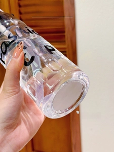 Close-up of the transparent plastic cup base with a white non-slip silicone bottom pad