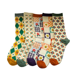 Five pack of women's argyle and floral cotton mid-calf socks in diverse patterns