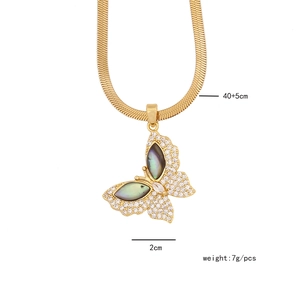 Detail of gold butterfly pendant with iridescent stones and size 40+5cm 2cm 7g